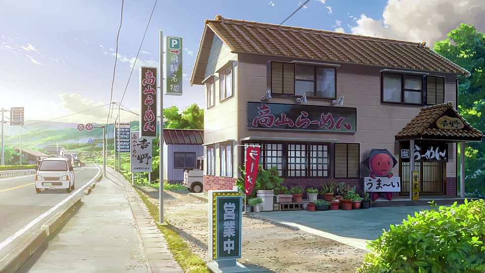 日间乡间公路旁的日式拉面店，配有竖排商铺招牌与路边盆栽。