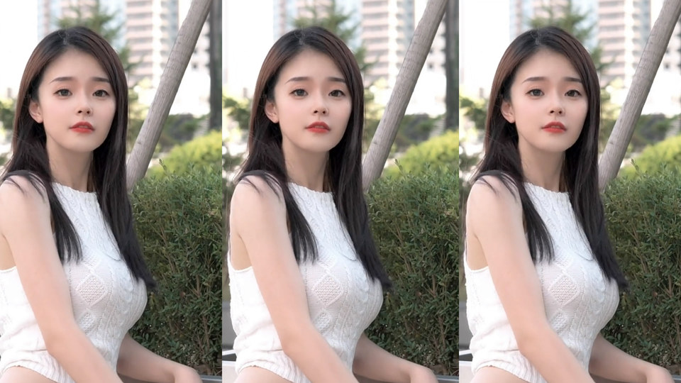 清纯人像主题户外日间绿地旁，穿白色无袖针织上衣的年轻东亚女性正对镜头，背景有高层住宅楼与灌木丛