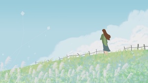 草地上看风筝的女孩