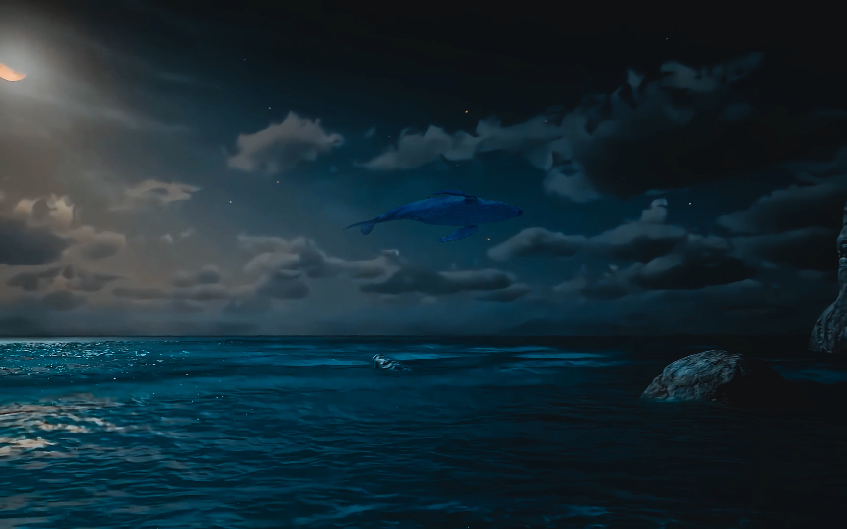 深蓝月夜海面上方，一头蓝色巨鲸在云层间悬浮，海面泛着冷调波光。